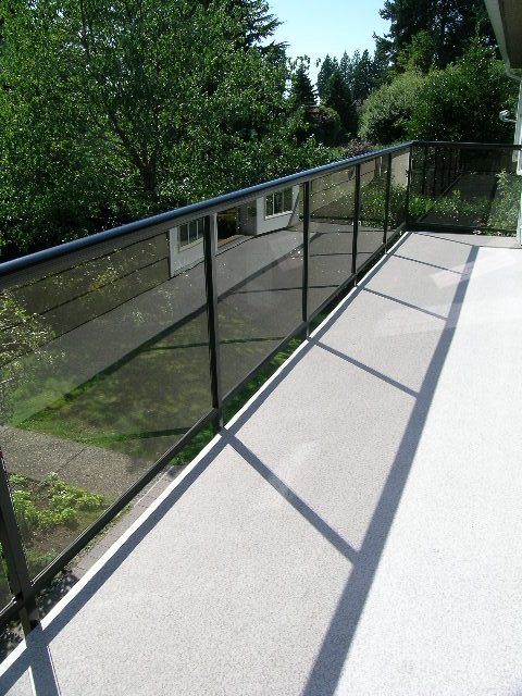Furnished balcony with glass railings and outdoor seating area. - #2 (Upper) - 350 23rd St E, North Vancouver