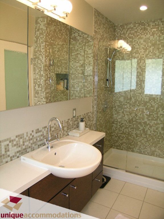 Modern bathroom with mosaic tiles and a walk-in shower. - 68 Bonnymuir Drive, West Vancouver