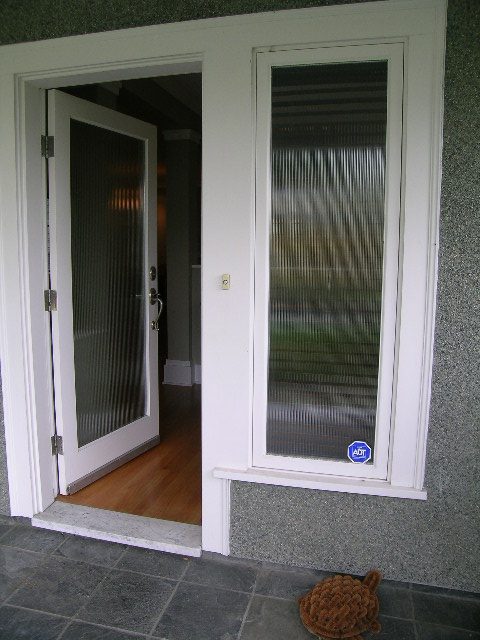 Entryway with frosted glass doors and hardwood flooring. - 3670 Point Grey Road, Vancouver West Side