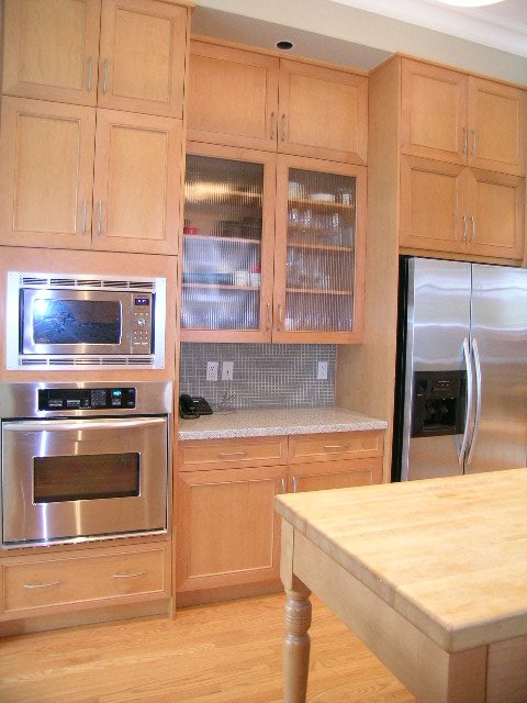 Bright kitchen with light wood cabinets, stainless steel appliances, and hardwood floors. - 3670 Point Grey Road, Vancouver West Side