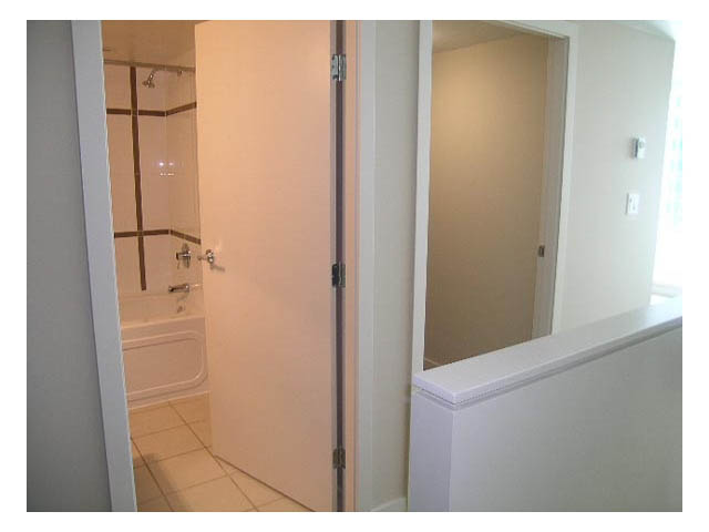 Furnished bathroom with white cabinetry and tiled floor. - 614 - 610 Granville St, Vancouver Downtown