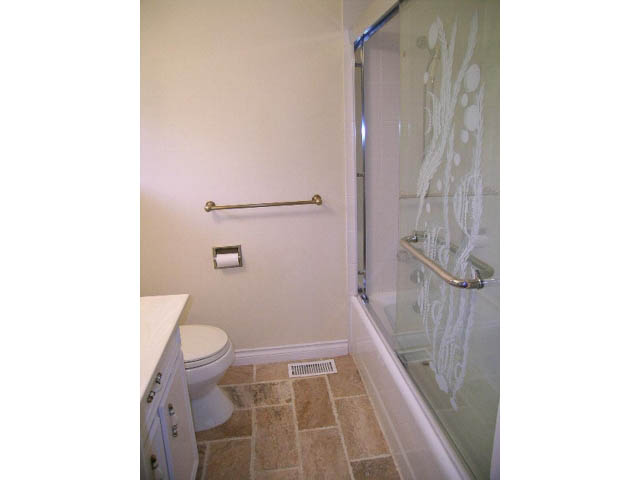 Furnished bathroom with glass shower and tiled floor. - 5725 Cranley Drive, West Vancouver