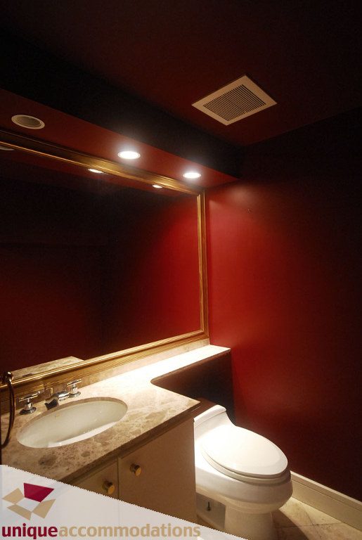Bathroom with red walls, marble countertop, and modern fixtures. - T15 - 1501 Howe Street, Vancouver Downtown