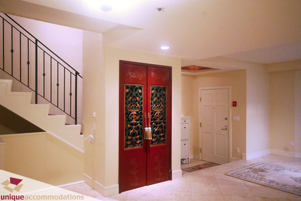 Foyer with red double doors and staircase leading up. - T15 - 1501 Howe Street, Vancouver Downtown
