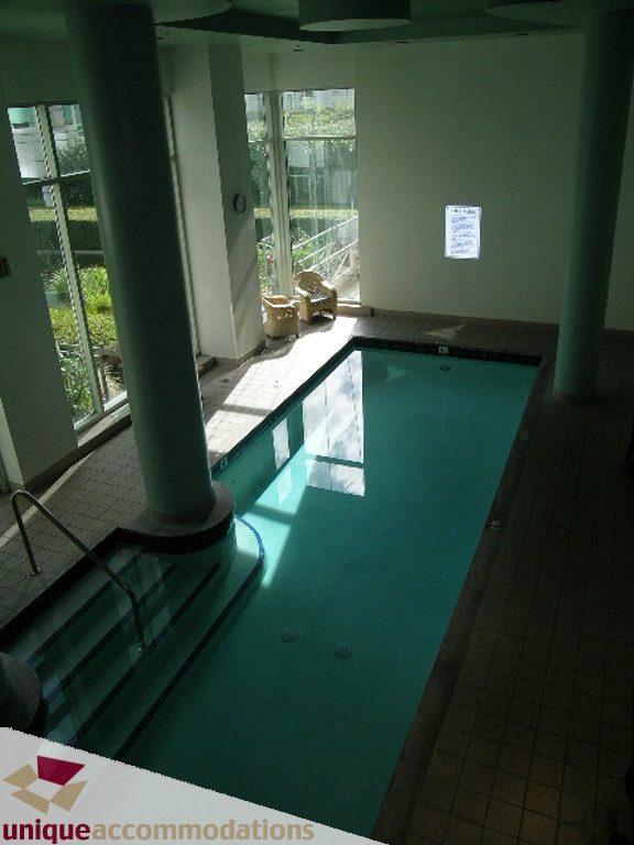 Spacious indoor pool with large windows and natural light. - T15 - 1501 Howe Street, Vancouver Downtown