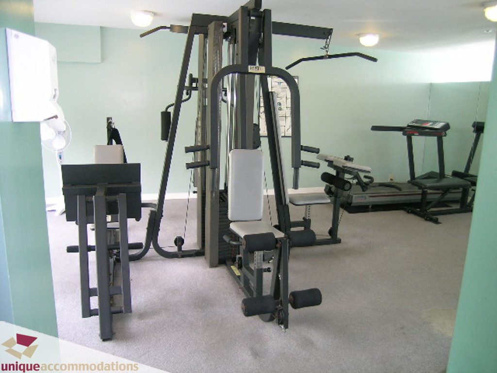 Bright gym with cardio equipment and weight machines. - T15 - 1501 Howe Street, Vancouver Downtown