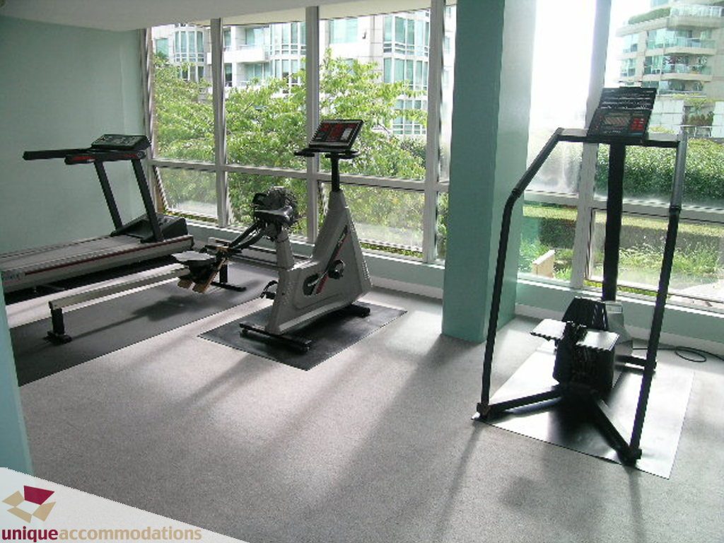 Bright fitness room with city view and modern equipment. - T15 - 1501 Howe Street, Vancouver Downtown