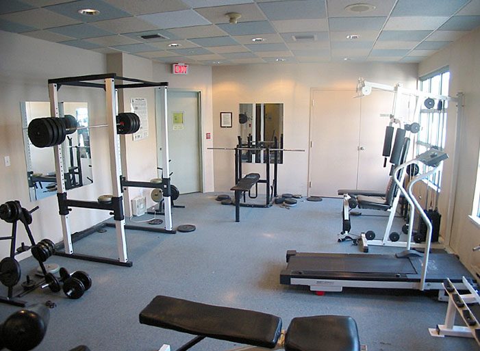Bright gym with weightlifting equipment and treadmills, spacious and well-lit. - 1403 - 907 Beach Avenue, Vancouver Downtown