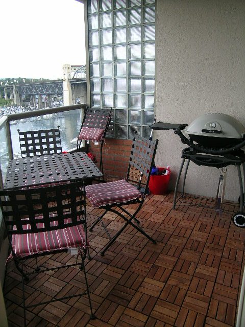Balcony with outdoor furniture and grill, overlooking water. - 902 - 1625 Hornby Street, Vancouver Downtown