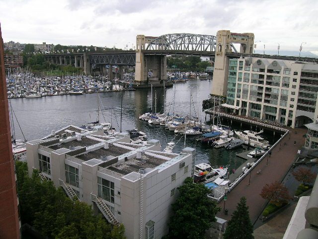 Bright kitchen with city view and waterfront access, featuring modern furnishings and a cozy den area. - 902 - 1625 Hornby Street, Vancouver Downtown