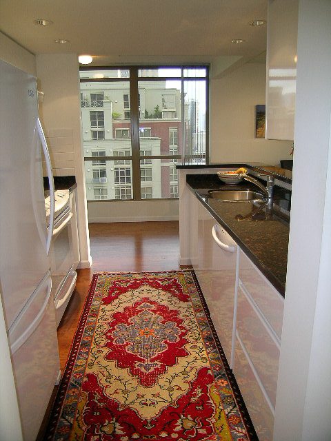Bright kitchen with granite countertops, hardwood floors, and a city view. - 1701 - 867 Hamilton Street, Vancouver Downtown