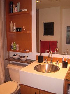 Bathroom with modern sink, wooden shelves, and a large mirror. - 2901-1438 Richards Street, Vancouver Downtown