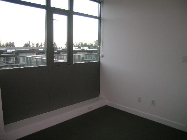Bright living room with large windows and city view. - 602 - 5782 Berton Avenue, Vancouver West Side