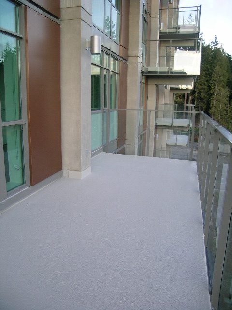 Spacious balcony with modern railings and city view. - 602 - 5782 Berton Avenue, Vancouver West Side