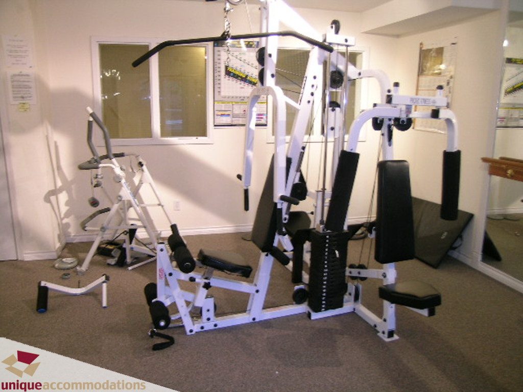 Fitness room with exercise equipment and mirrors. - 208 - 128 West 8th Street, North Vancouver