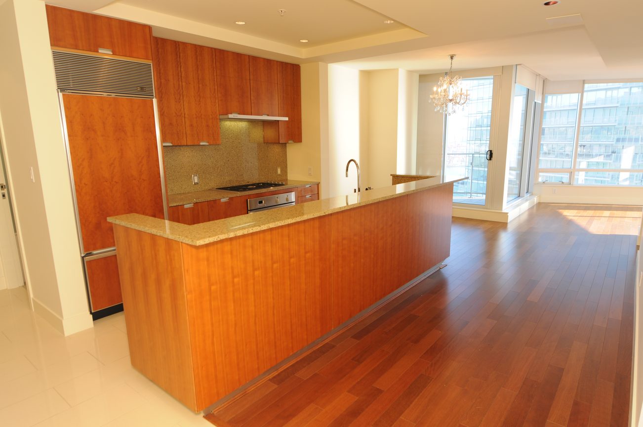 Bright kitchen with granite countertops, hardwood floors, and a city view. - 2304 - 1077 West Cordova St, Vancouver Downtown