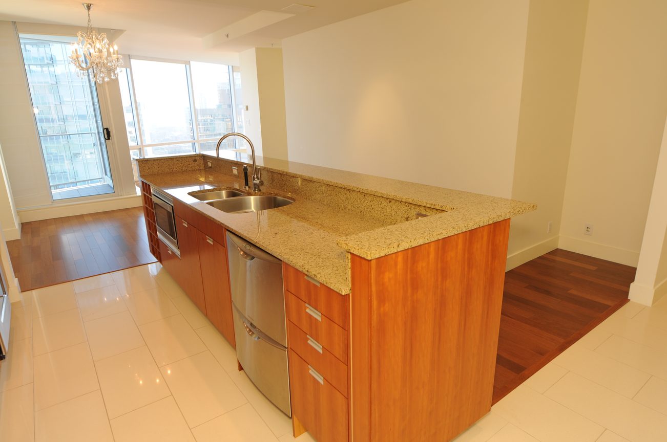 Bright kitchen with granite countertops, hardwood floors, and a city view. - 2304 - 1077 West Cordova St, Vancouver Downtown
