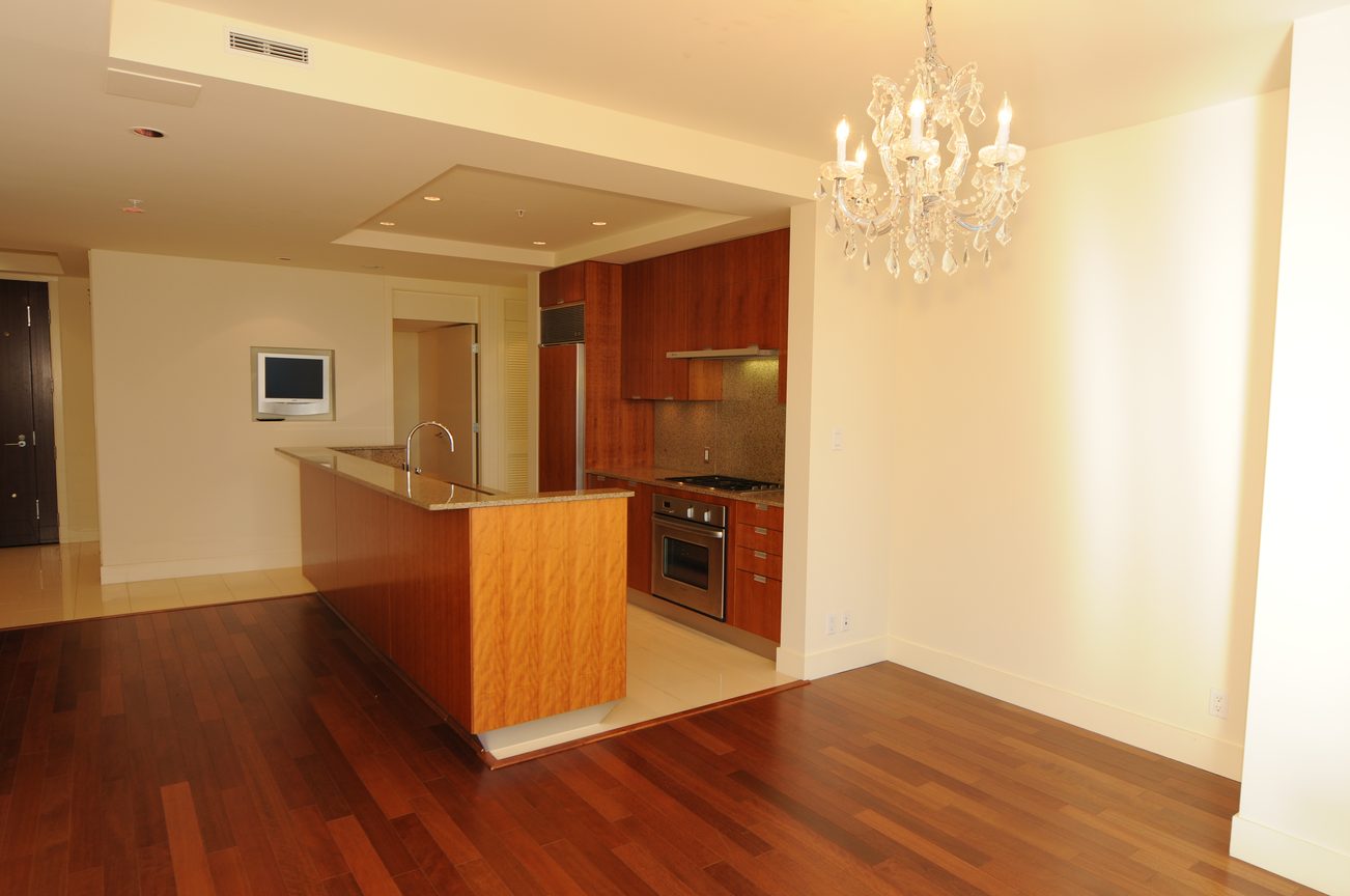 Bright kitchen with hardwood floors, granite countertops, and a chandelier. - 2304 - 1077 West Cordova St, Vancouver Downtown