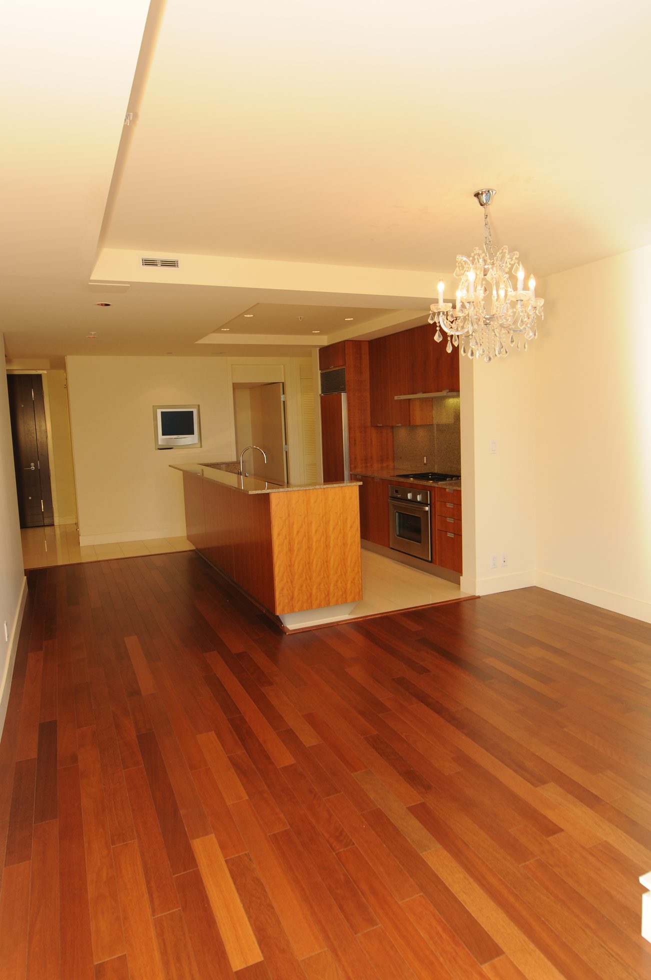 Bright kitchen with hardwood floors and a chandelier, modern design. - 2304 - 1077 West Cordova St, Vancouver Downtown