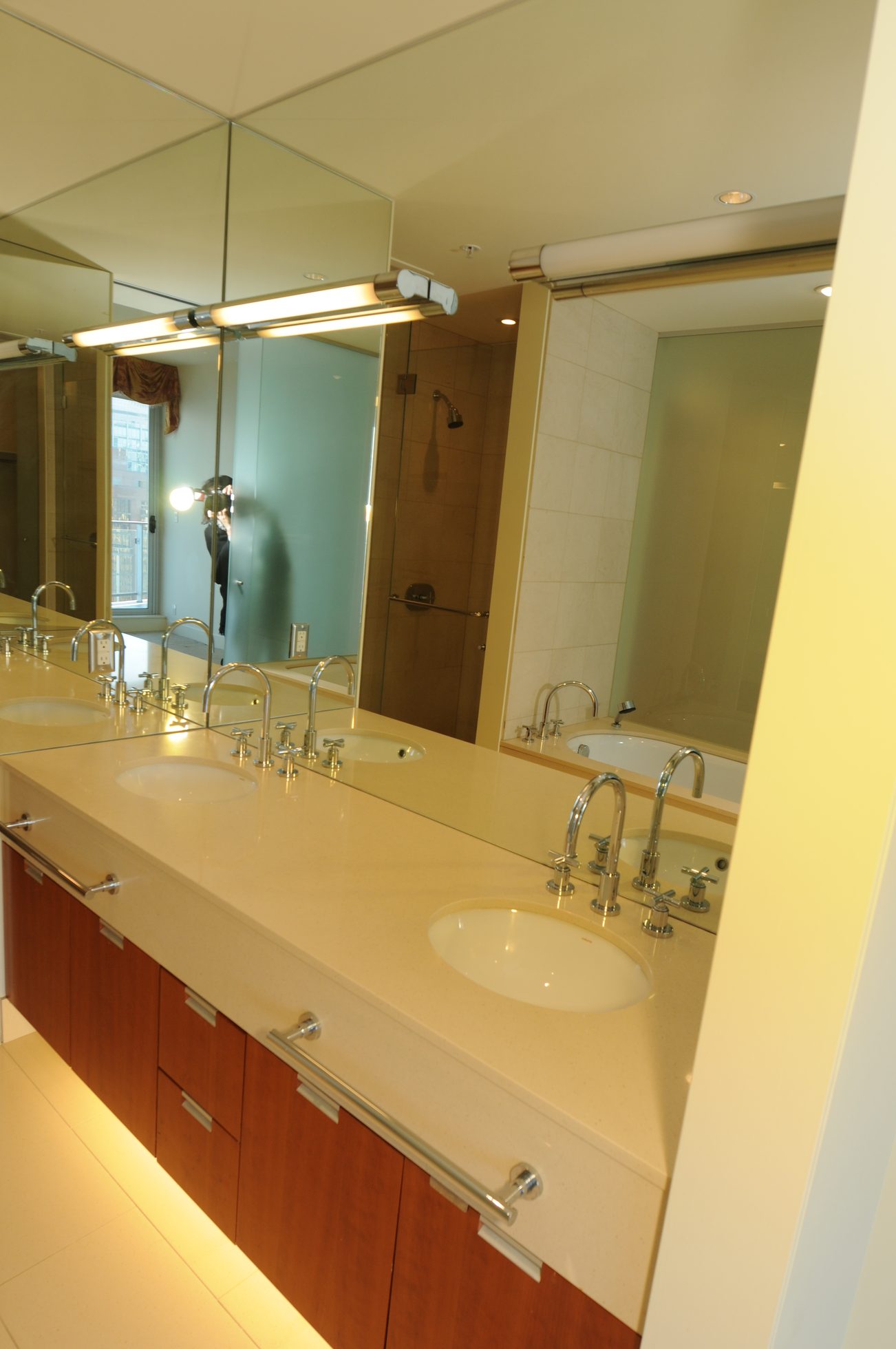 Bathroom with double sinks, modern fixtures, and large mirror. - 2304 - 1077 West Cordova St, Vancouver Downtown