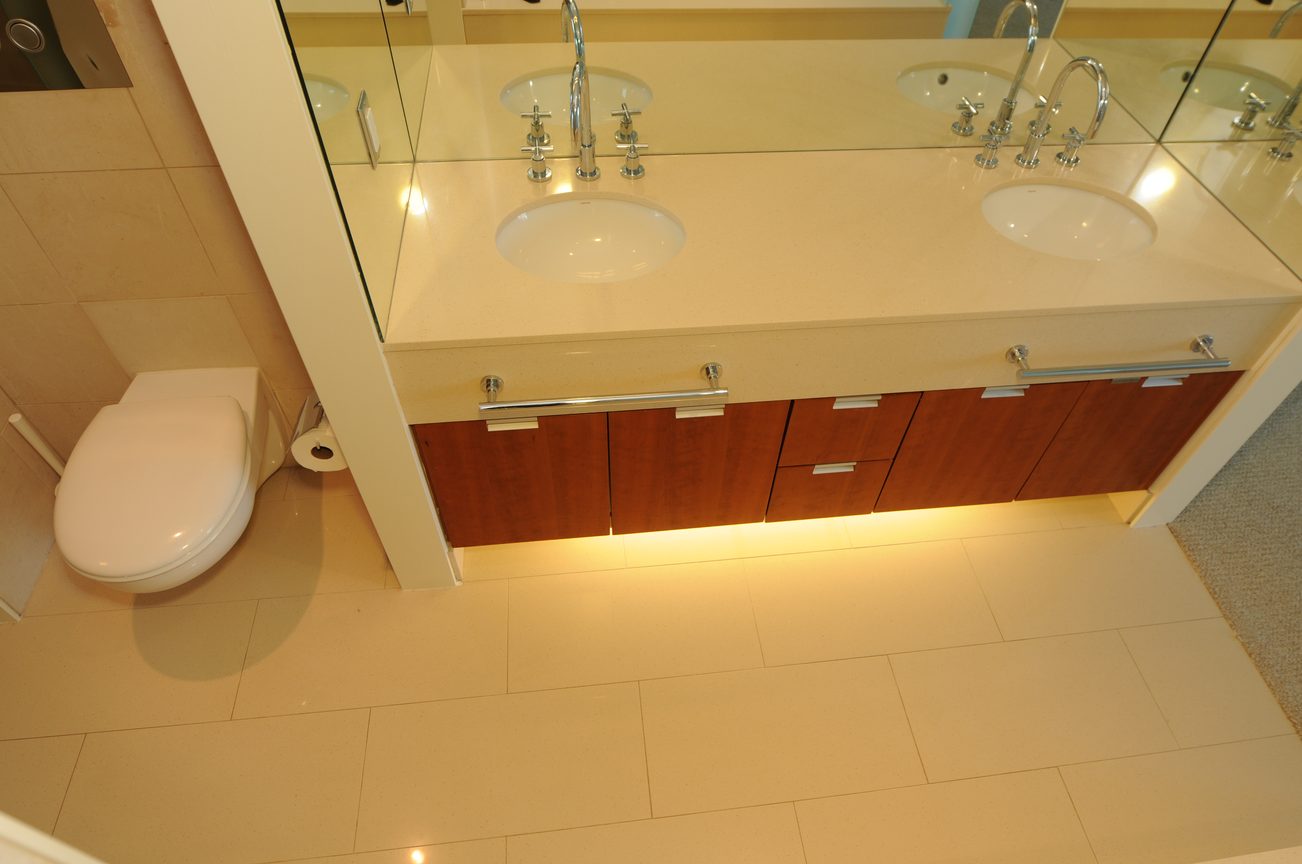 Furnished bathroom with modern vanity, wood cabinets, and undermount sinks. - 2304 - 1077 West Cordova St, Vancouver Downtown