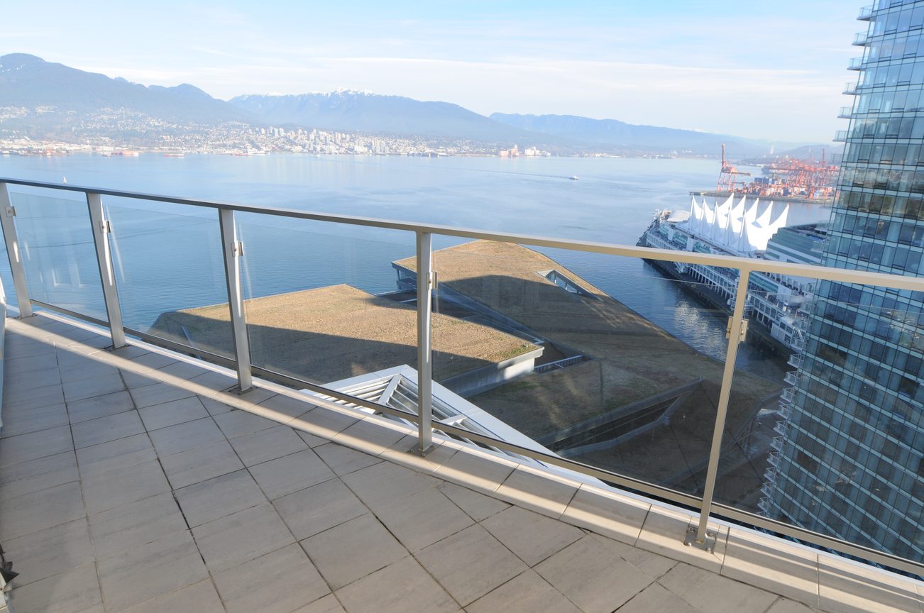 Bright balcony with stunning city view and modern glass railing. - 2304 - 1077 West Cordova St, Vancouver Downtown