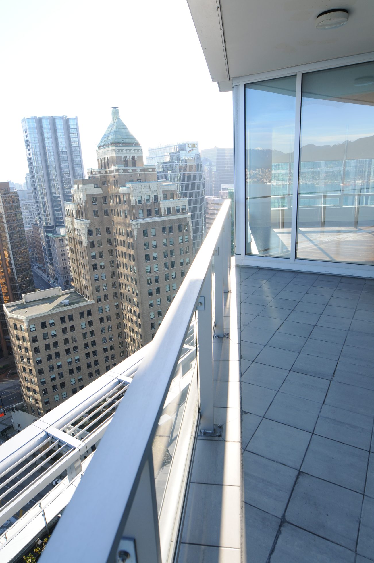 Furnished balcony with city view and modern railing. - 2304 - 1077 West Cordova St, Vancouver Downtown