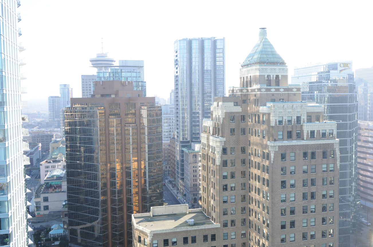 Bright living room with city view, modern furnishings. - 2304 - 1077 West Cordova St, Vancouver Downtown