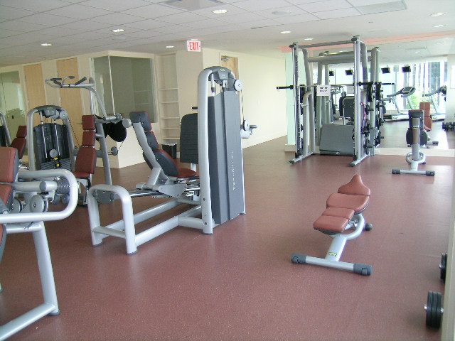 Fitness room with cardio and weight machines, clean and organized. - 2304 - 1077 West Cordova St, Vancouver Downtown