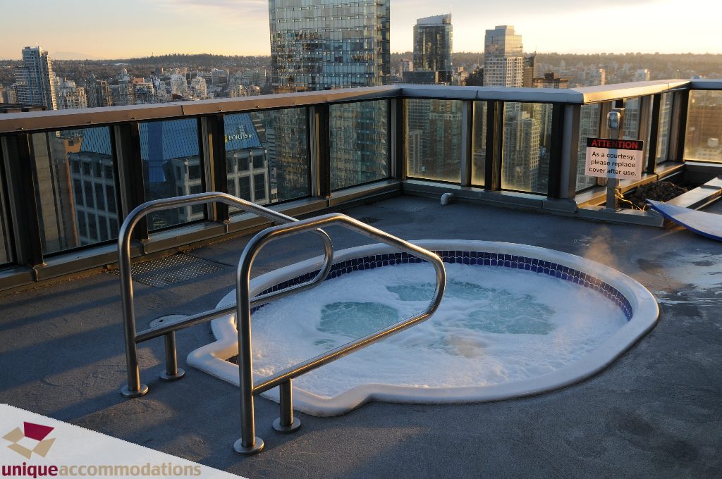 Spacious rooftop hot tub with city view, perfect for relaxation. - 1802 - 1189 Melville Street, Vancouver Downtown