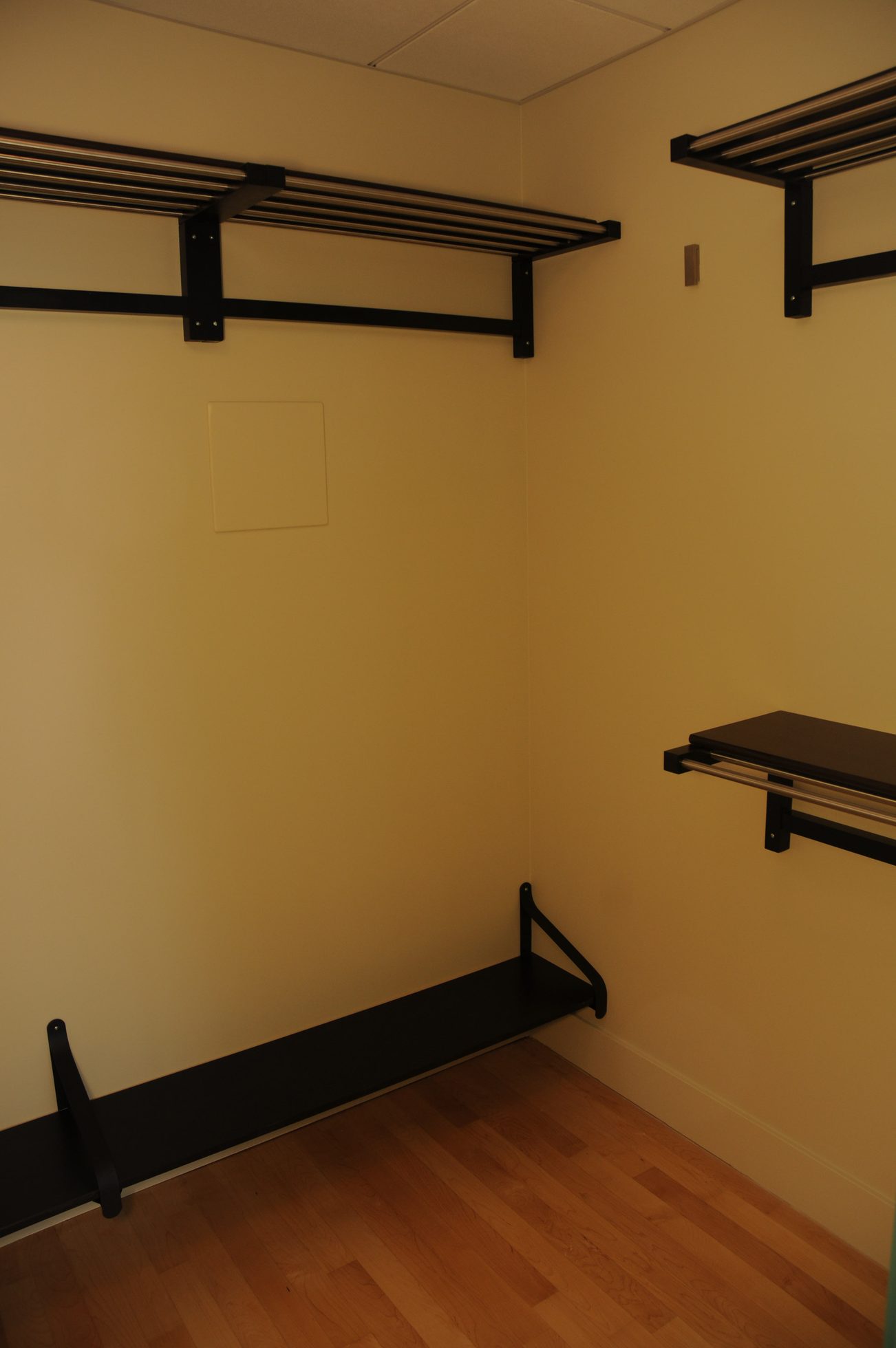 Bright living room with wall-mounted shelves and hardwood floors. - 3103 - 1077 West Cordova, Vancouver Downtown