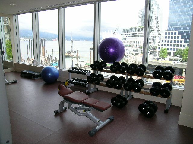 Fitness room with dumbbells, exercise ball, and city view. - 3103 - 1077 West Cordova, Vancouver Downtown
