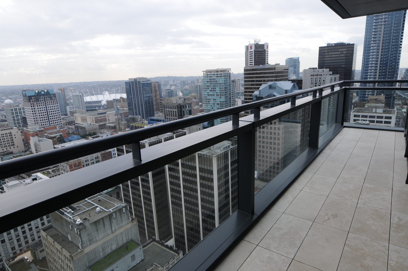 Balcony with city view and modern railings. - 3303 - 838 Hastings Street, Vancouver Downtown