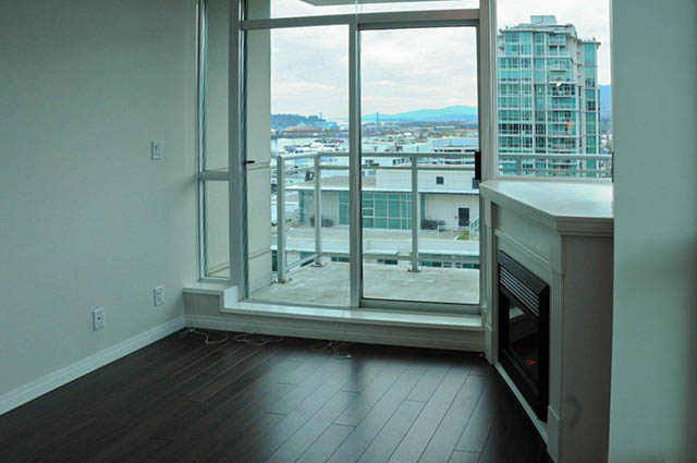 Bright living room with hardwood floors and city view. - 1808 - 188 East Esplanade, North Vancouver