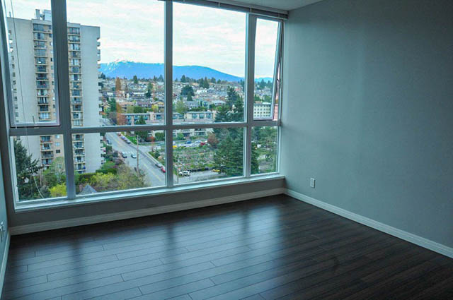 Bright living room with hardwood floors and a stunning city view. - 1808 - 188 East Esplanade, North Vancouver