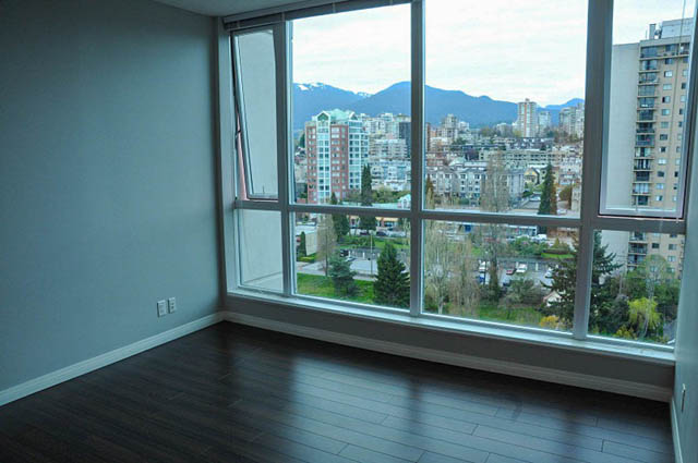 Bright living room with hardwood floors and a stunning city view. - 1808 - 188 East Esplanade, North Vancouver