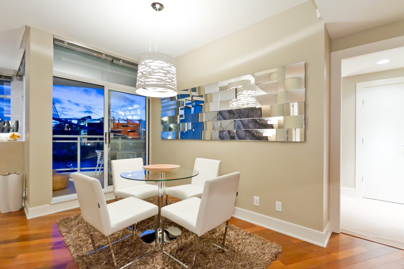 Furnished living room with hardwood floors, city view, and modern decor. - 302 - 628 Kinghorne Mews, Vancouver Downtown