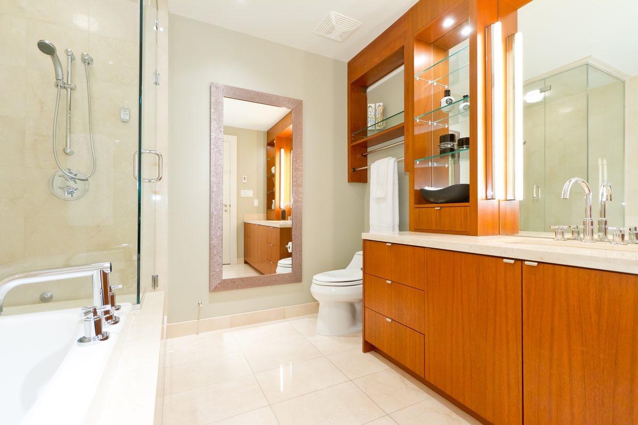 Spacious bathroom with wooden cabinets, modern fixtures, and a walk-in shower. - 302 - 628 Kinghorne Mews, Vancouver Downtown