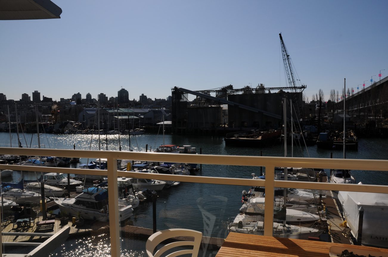 Balcony view of marina with boats and city skyline, sunny day. - 302 - 628 Kinghorne Mews, Vancouver Downtown
