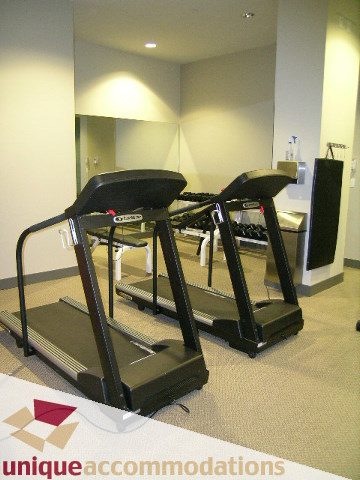 Fitness room with treadmills and mirrors. - 302 - 628 Kinghorne Mews, Vancouver Downtown