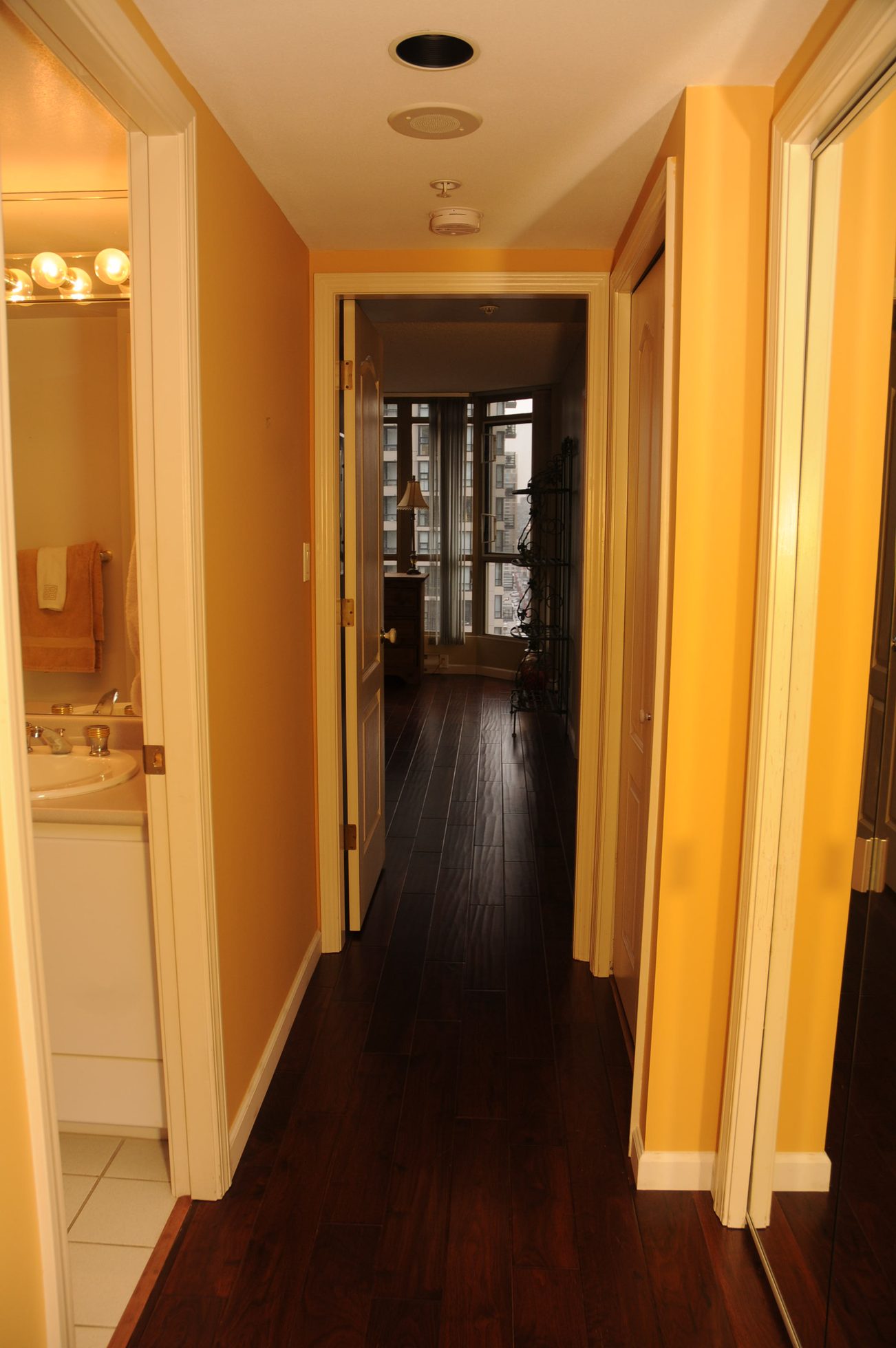 Furnished hallway with hardwood floors and city view. - 1705-867 Hamilton Street, Vancouver Downtown
