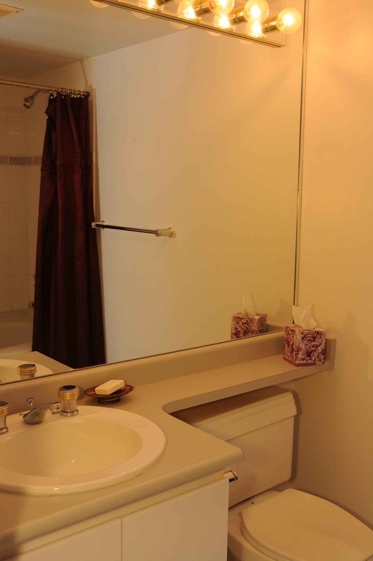 Bathroom with white countertop, sink, and tissue boxes. - 1705-867 Hamilton Street, Vancouver Downtown