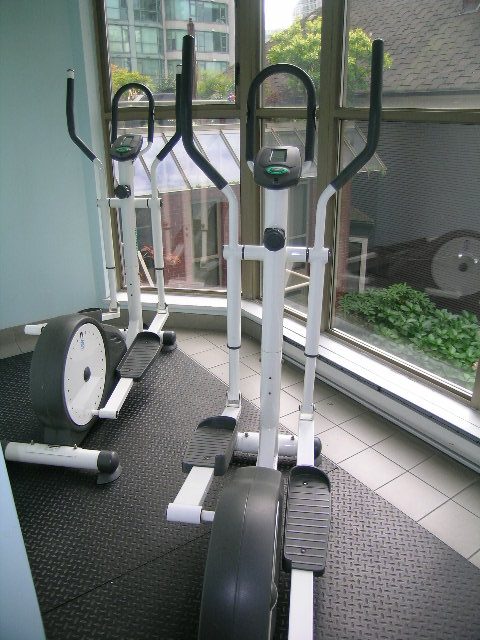 Bright gym with exercise equipment and city view. - 1705-867 Hamilton Street, Vancouver Downtown