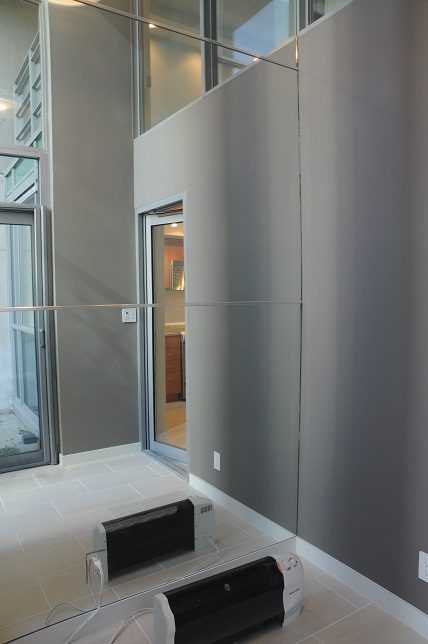 Modern kitchen with sleek stainless steel appliances and large windows. - 1275 Alberni Street, Vancouver Downtown