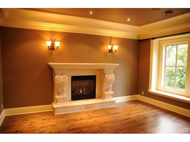Bright living room with hardwood floors and ornate fireplace. - 3570 West 42nd Avenue, Vancouver West Side