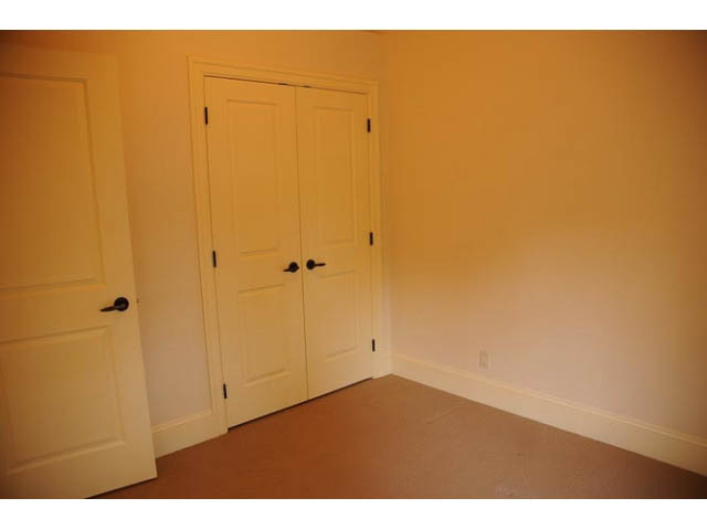 Empty bedroom with white doors and beige walls. - 3570 West 42nd Avenue, Vancouver West Side