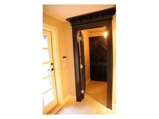 Foyer with dark wood trim and tiled flooring. - 3570 West 42nd Avenue, Vancouver West Side