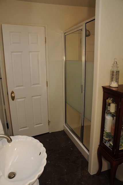 Bathroom with marble countertop and glass shower door. - 864 Fairway Drive, North Vancouver