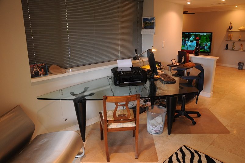 Bright home office with glass desk, wooden chair, and city view. - 864 Fairway Drive, North Vancouver
