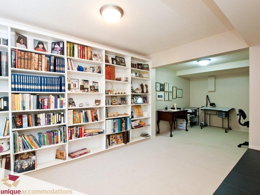 Bright and cozy den with built-in bookshelves and desk area, perfect for reading or working. - 750 Anderson Crescent, West Vancouver